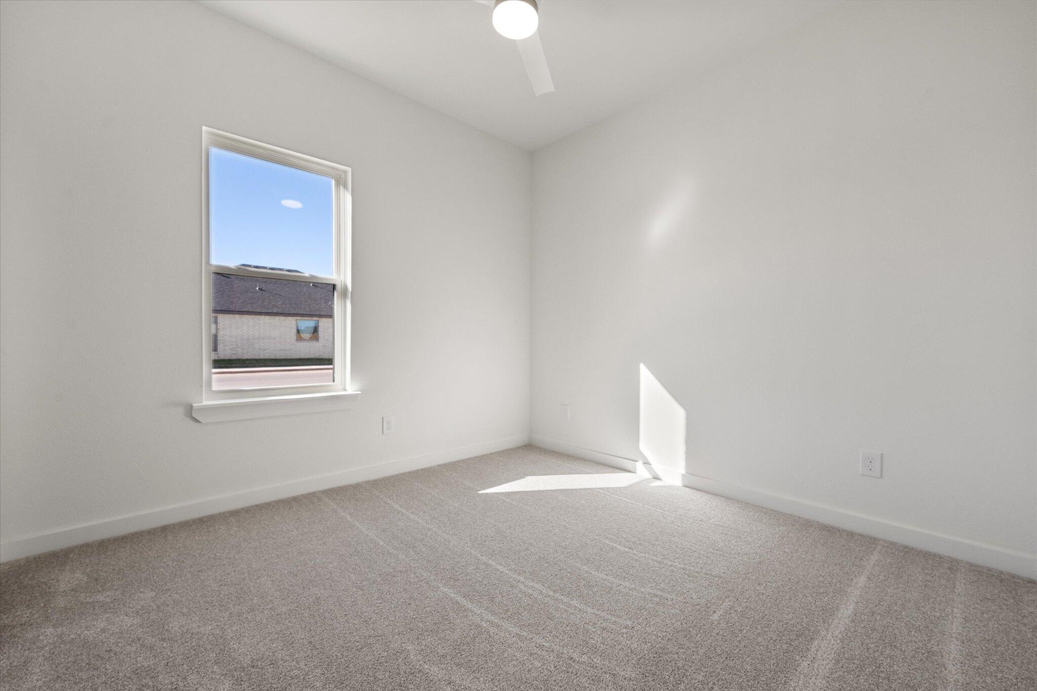 6928 14th Street Lubbock, TX 79416 - Photo 26 of 33 a view of a room that has a window in it