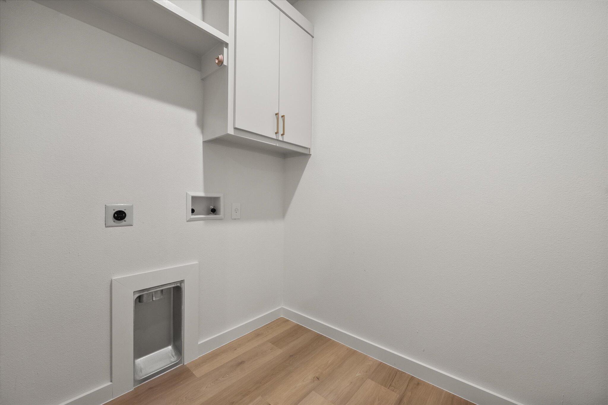 6928 14th Street Lubbock, TX 79416 - Photo 30 of 33 a view of small space with racks on the wall