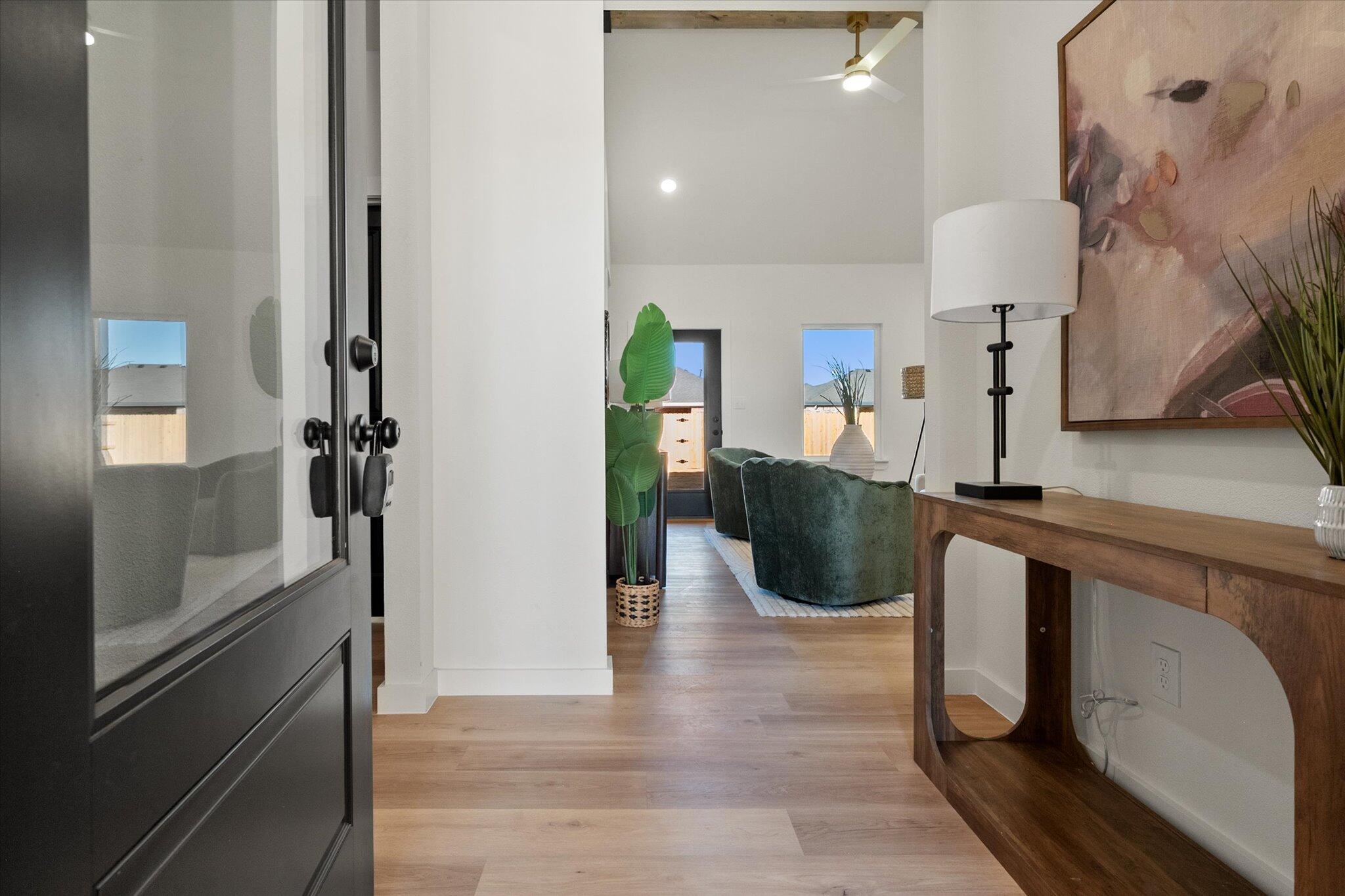 6928 14th Street Lubbock, TX 79416 - Photo 3 of 33 a view of a kitchen from the hallway