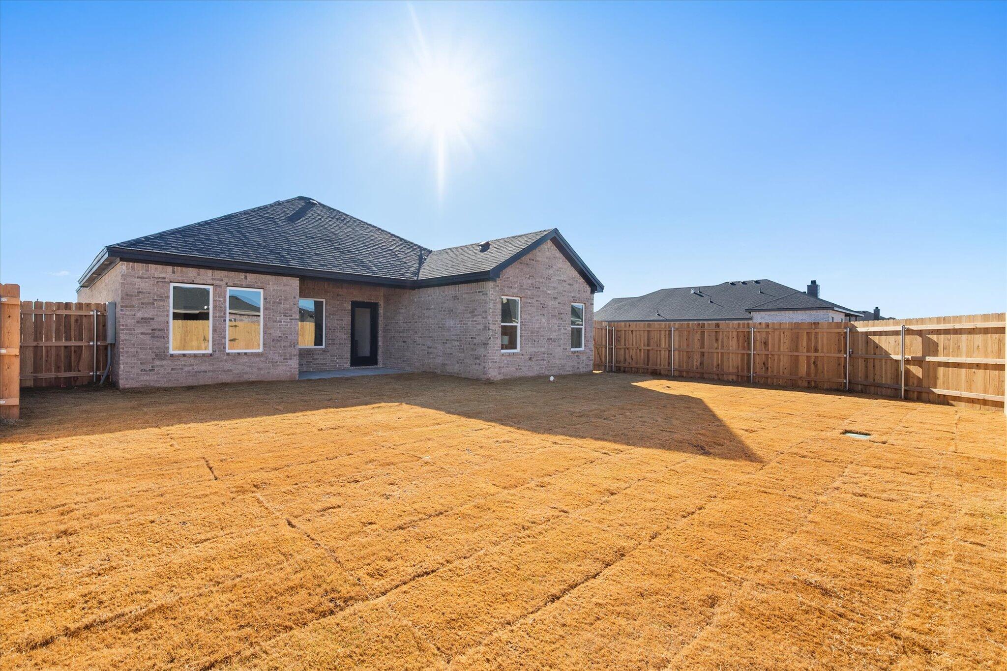 6928 14th Street Lubbock, TX 79416 - Photo 32 of 33 a view of an house with backyard and a tree