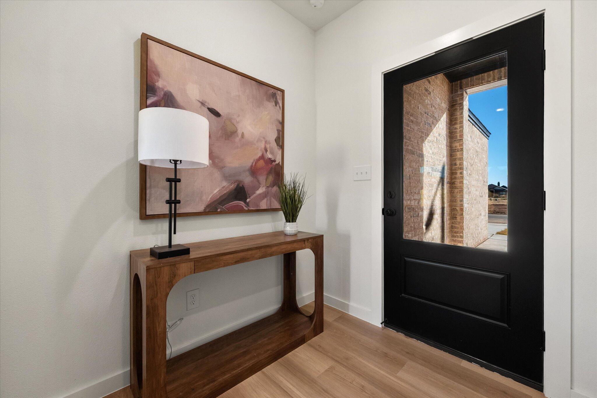 6928 14th Street Lubbock, TX 79416 - Photo 4 of 33 a view of front door with a mirror