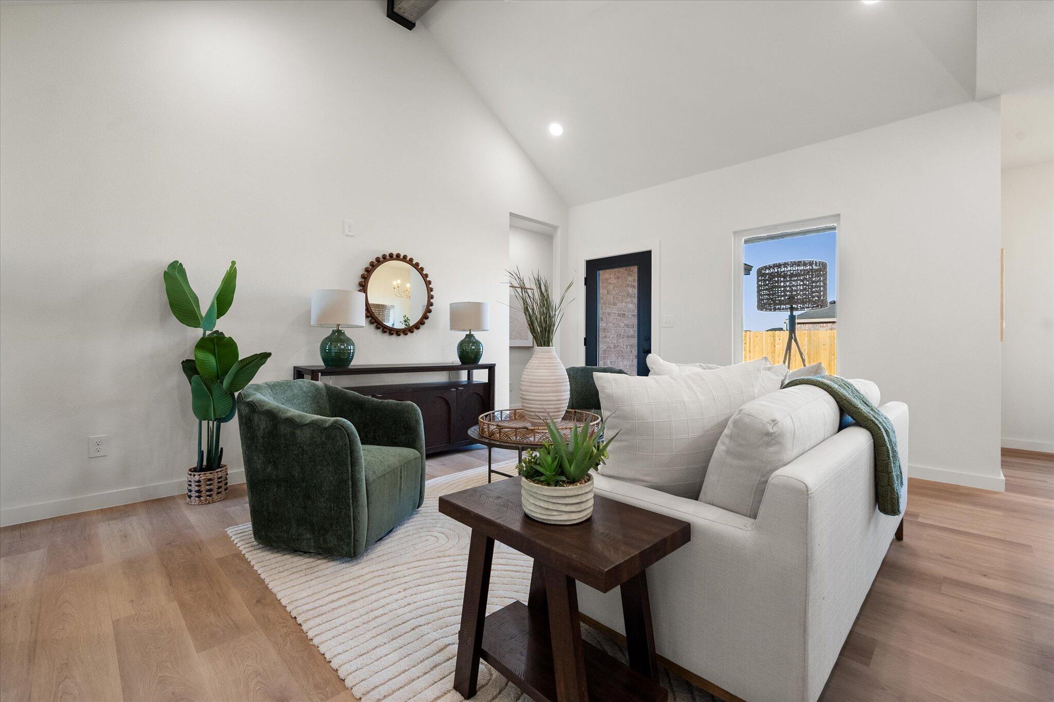 6928 14th Street Lubbock, TX 79416 - Photo 7 of 33 a living room with furniture and a potted plant