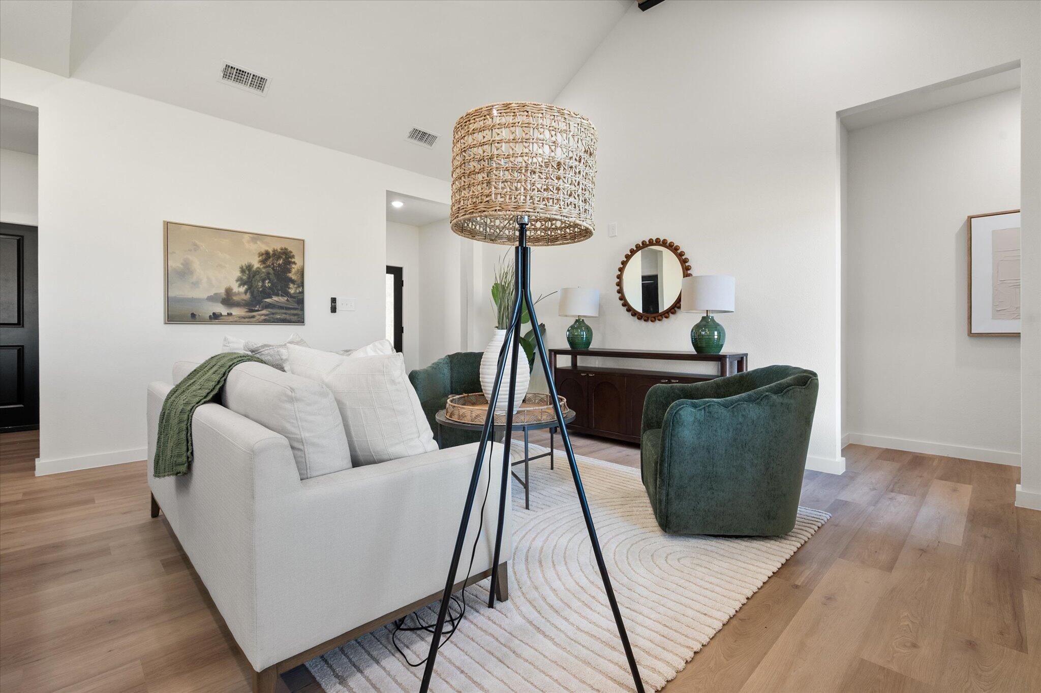 6928 14th Street Lubbock, TX 79416 - Photo 8 of 33 a living room with furniture and a wooden floor