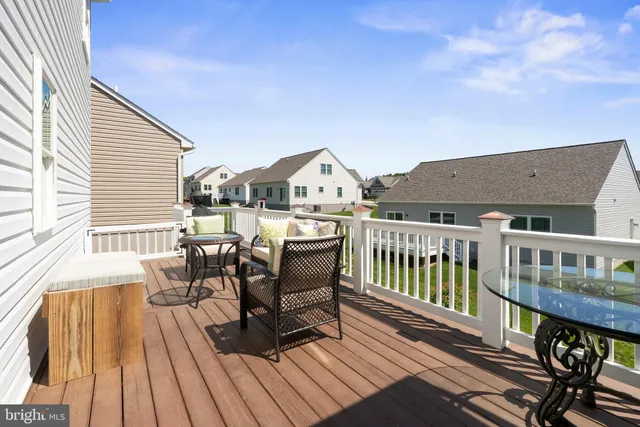 a view of a chairs and table on the deck