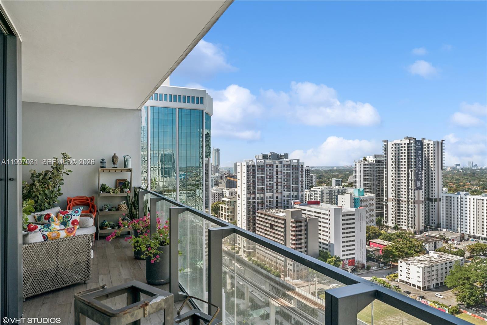 88 Southwest 7th Street, Unit 1804 Miami, FL 33130 - Photo 39 of 39 a view of a balcony with an outdoor seating