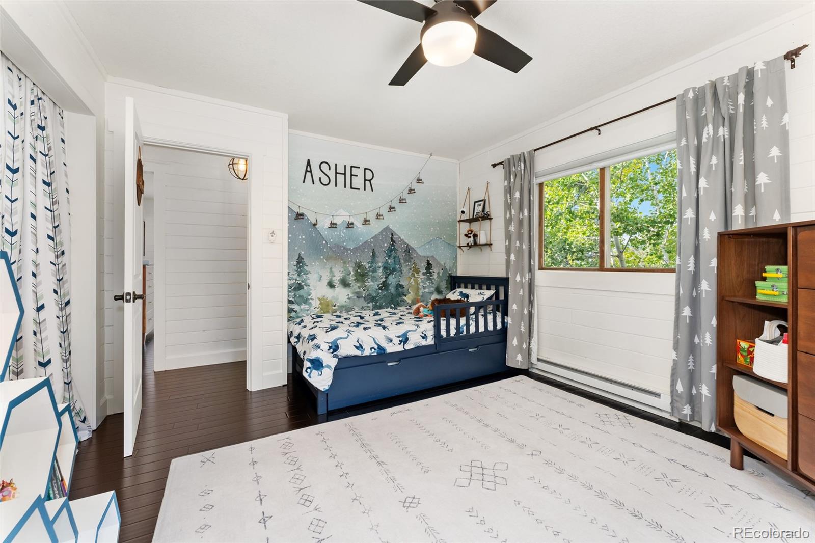 24333 Bent Feather Road Conifer, CO 80433 - Photo 23 of 50 a very nice looking room with a large window