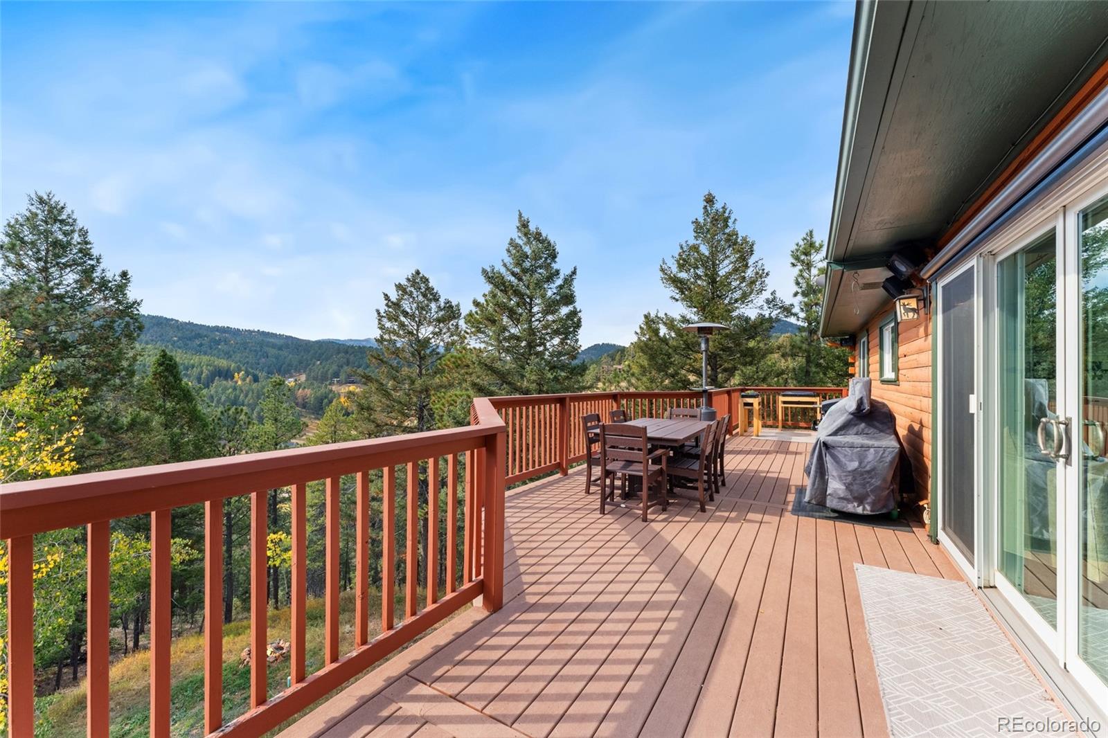 24333 Bent Feather Road Conifer, CO 80433 - Photo 40 of 50 a view of balcony with furniture