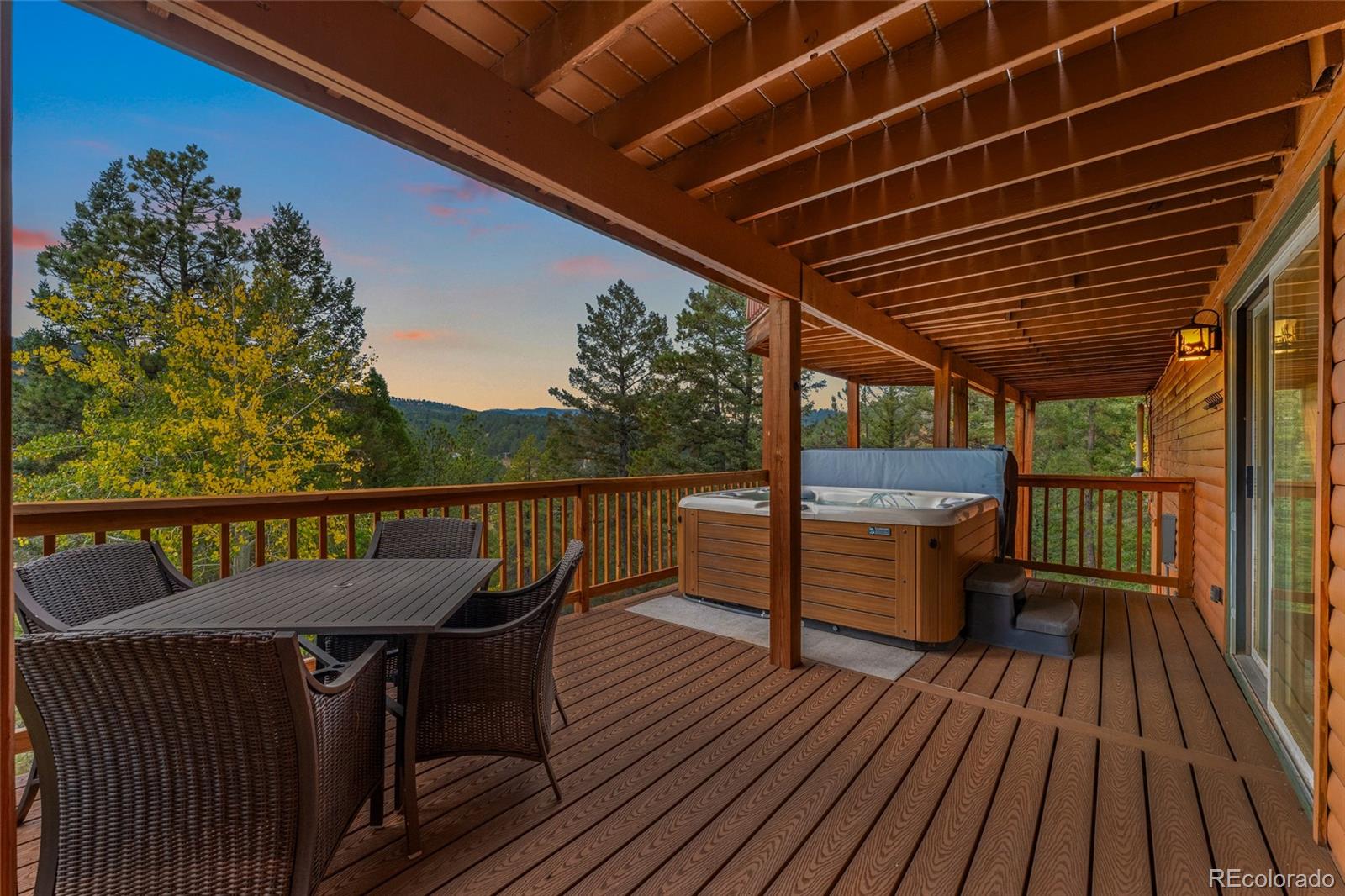 24333 Bent Feather Road Conifer, CO 80433 - Photo 48 of 50 a view of balcony with wooden floor and outdoor seating
