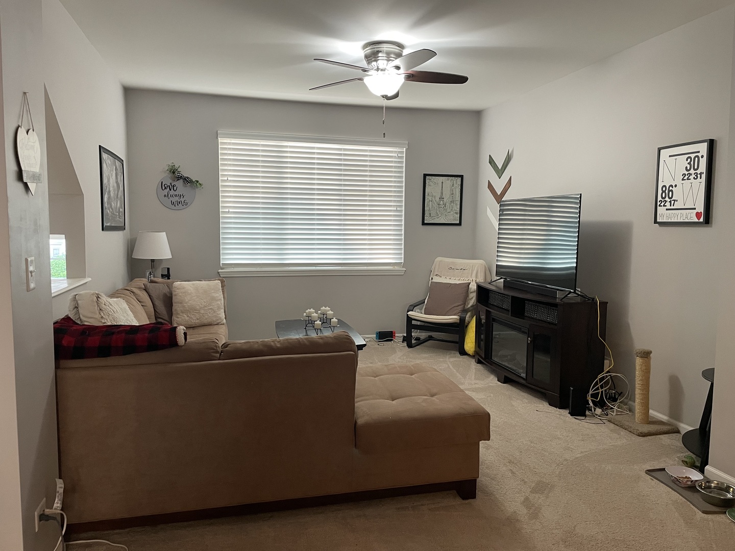 3350 Ravinia Circle Aurora, IL 60504 - Photo 4 of 11 a living room with furniture and a flat screen tv