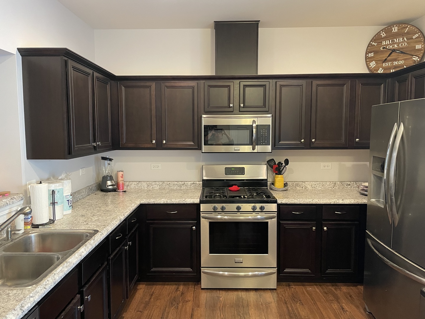 3350 Ravinia Circle Aurora, IL 60504 - Photo 5 of 11 a kitchen with granite countertop wooden cabinets and stainless steel appliances