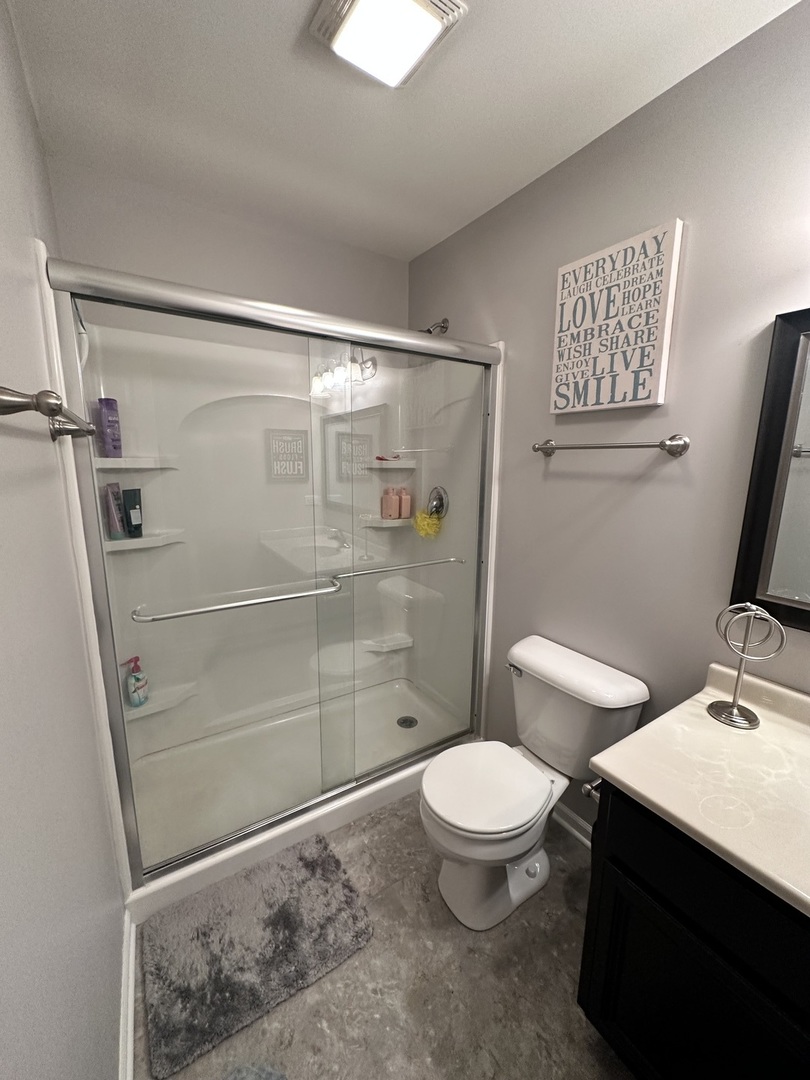 3350 Ravinia Circle Aurora, IL 60504 - Photo 9 of 11 a bathroom with a toilet a sink and shower