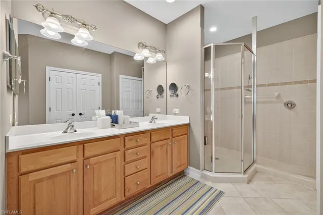a bathroom with a double vanity sink mirror and double