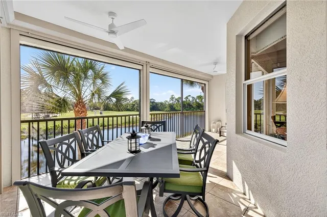 a view of a city from a dining room with furniture window and outside view