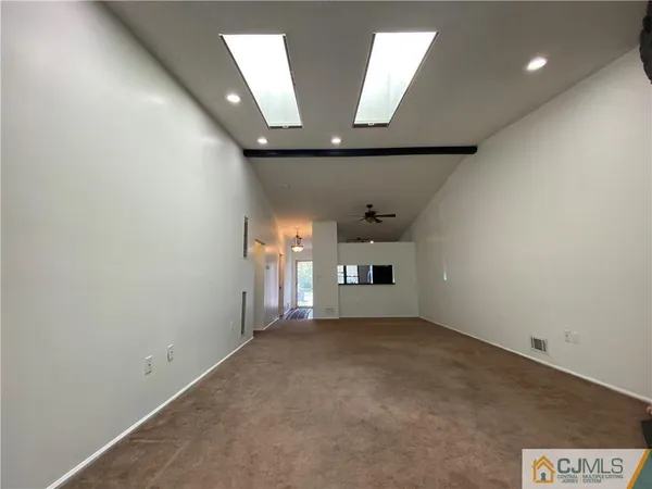 wooden floor in an empty room with a fireplace