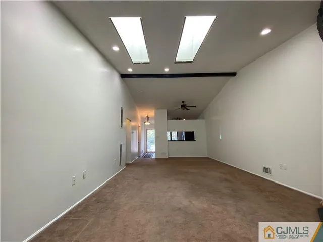 wooden floor in an empty room with a fireplace