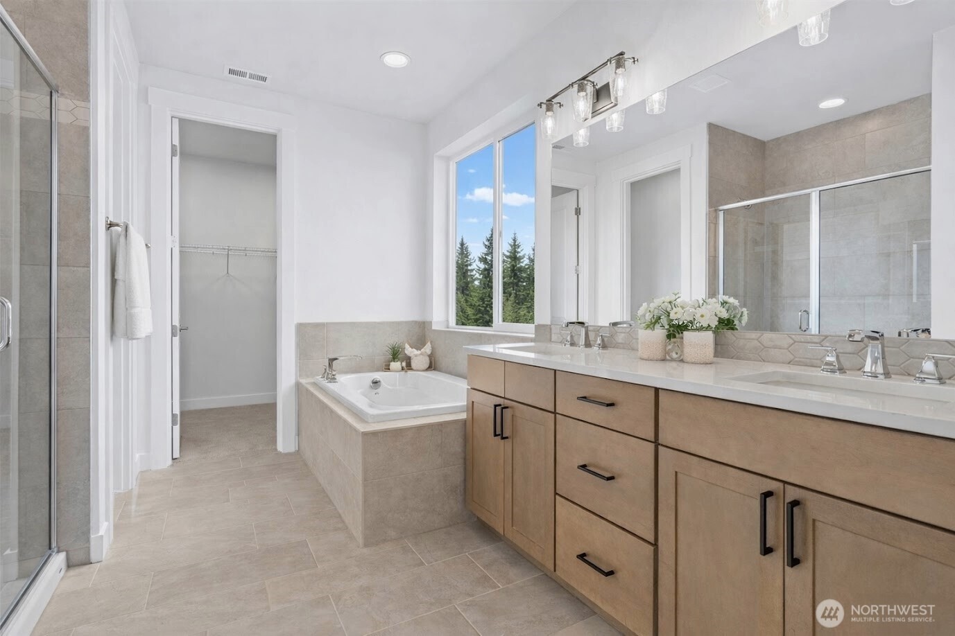 646 Prominence Street Winlock, WA 98596 - Photo 5 of 10 a bathroom with a double vanity sink mirror and bathtub