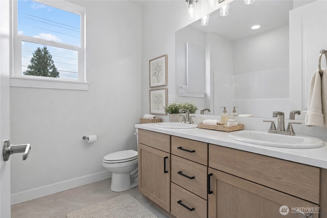 646 Prominence Street Winlock, WA 98596 - Photo 6 of 10 a bathroom with a granite countertop toilet sink and mirror