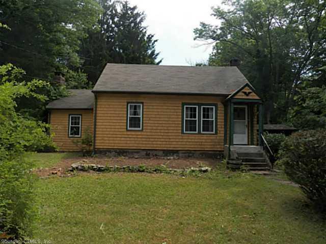 306 Hidden Lake Road Haddam, CT 06441 - Photo 1 of 1 a front view of a house with garden