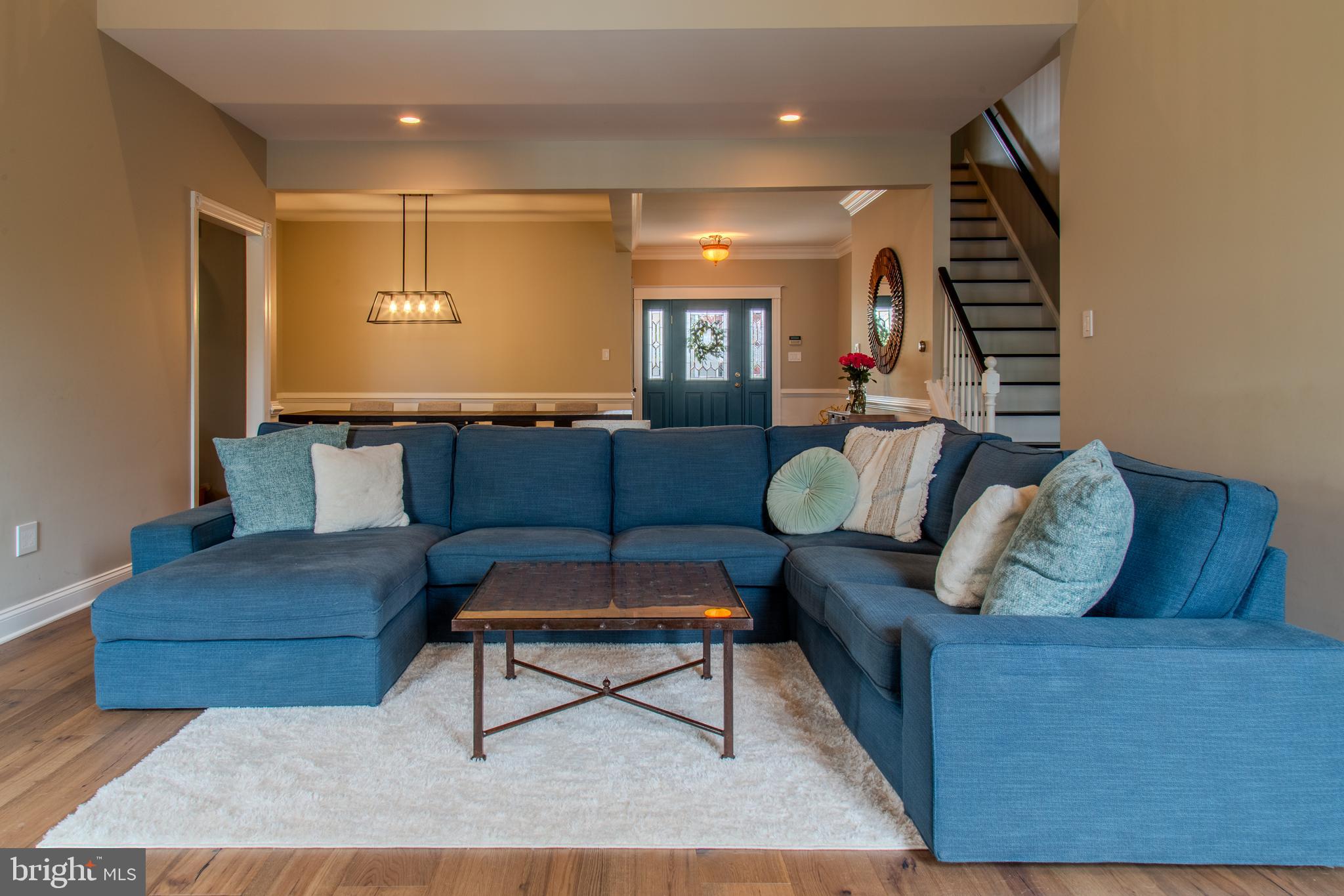33 Evesham Avenue Marlton, NJ 08053 - Photo 11 of 45 a living room with furniture and a ceiling fan