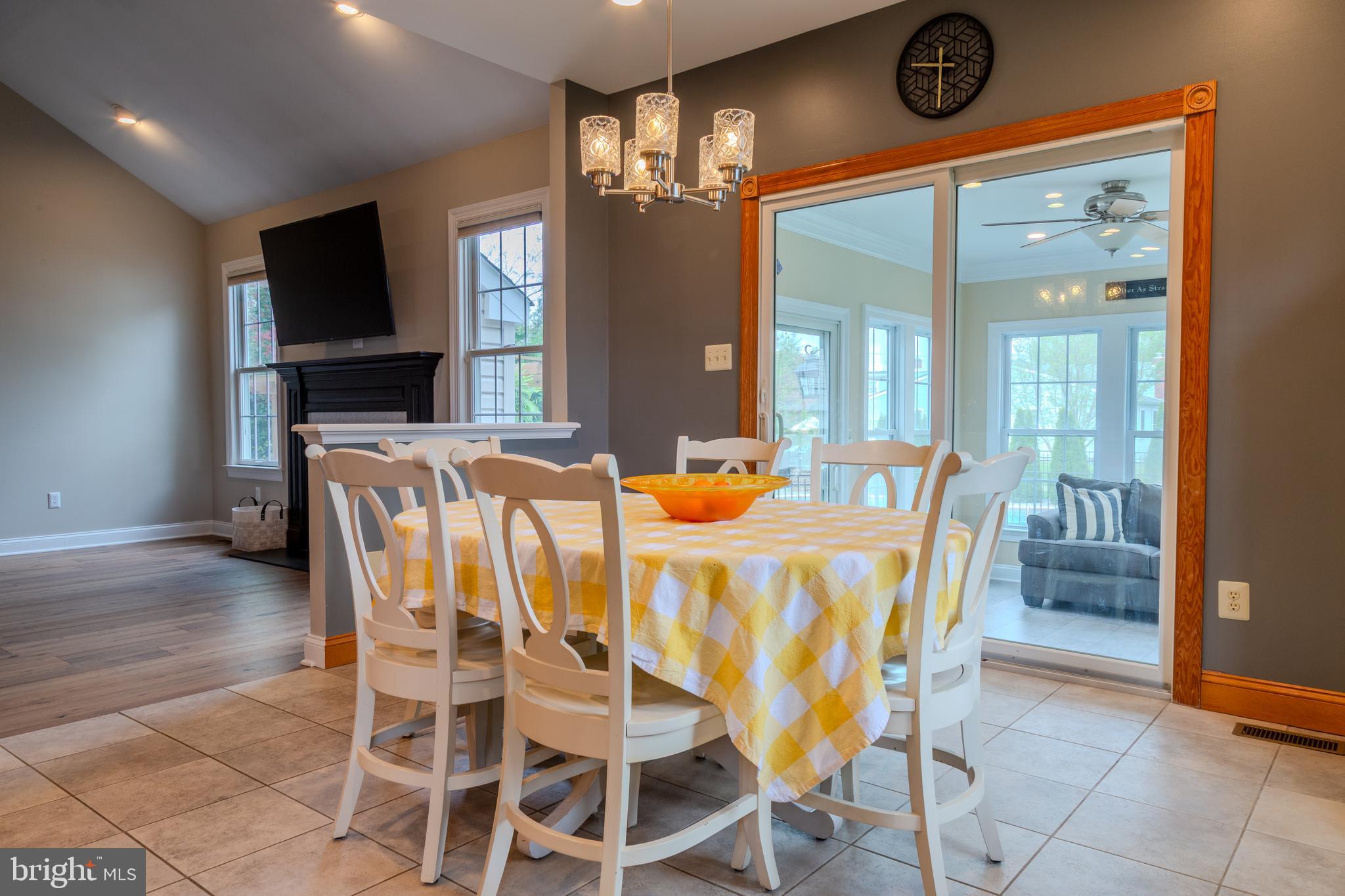33 Evesham Avenue Marlton, NJ 08053 - Photo 16 of 45 a dining room with furniture a flat screen tv and a view of kitchen