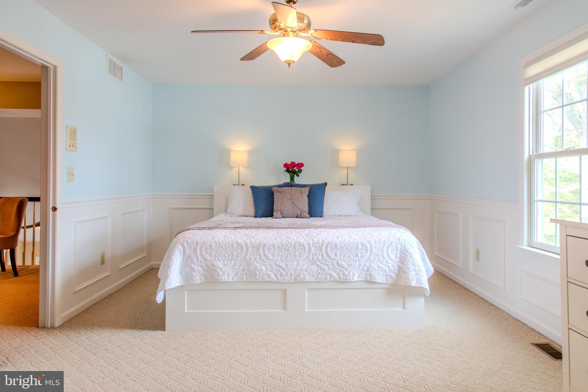 33 Evesham Avenue Marlton, NJ 08053 - Photo 35 of 45 a bedroom with a bed and a chandelier
