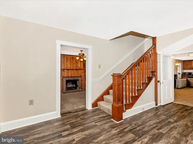 a view of an entryway with wooden floor