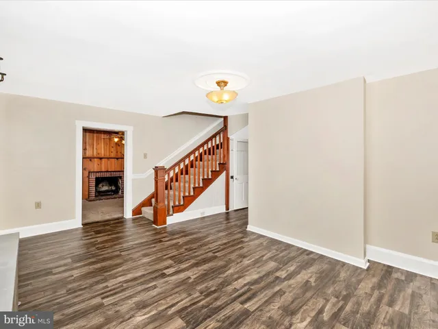 a view of a livingroom with an empty space and a fireplace