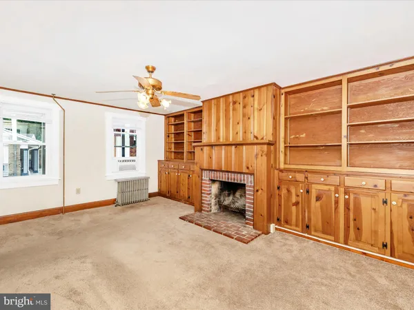 a kitchen with a refrigerator and a stove top oven