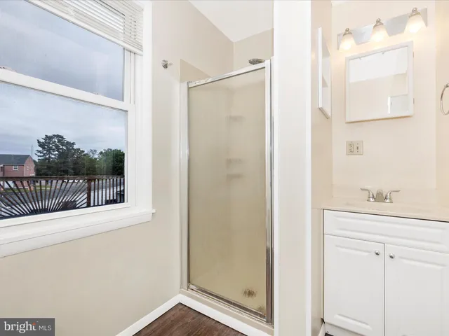 a bathroom with a sink and shower