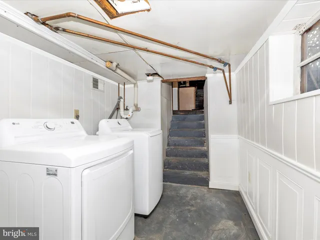 a view of a brick house with many windows