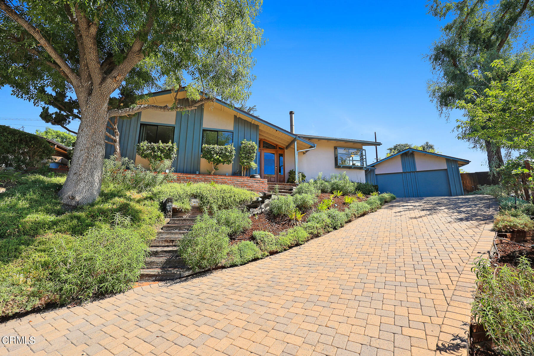 3451 Brookhill Street Glendale, CA 91214 - Photo 11 of 65 a front view of a house with a yard and potted plants