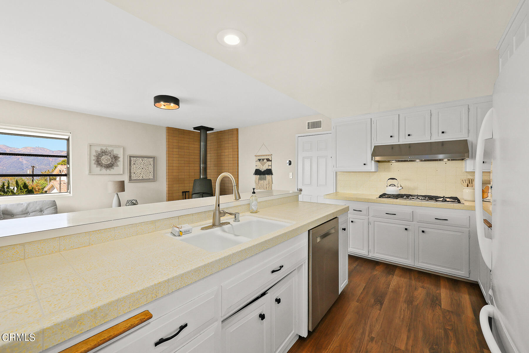 3451 Brookhill Street Glendale, CA 91214 - Photo 28 of 65 a kitchen with a sink stove and cabinets