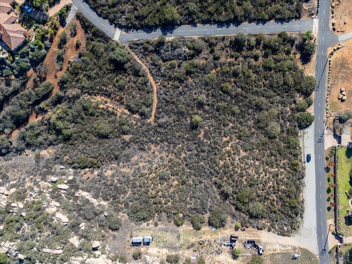 Hawkeye Hawkeye Downs Way, Unit A70 Ramona, CA 92065 - Photo 9 of 11 a view of a dry yard with trees and bushes