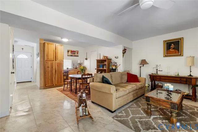 a living room with furniture and a table