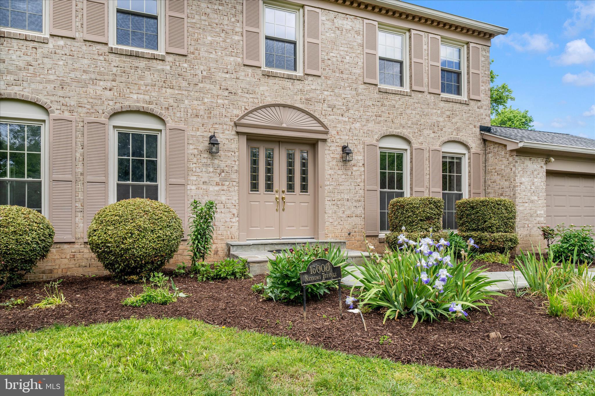 16000 Narrows Terrace Silver Spring, MD 20906 - Photo 2 of 54 a view of a house with a garden and plants