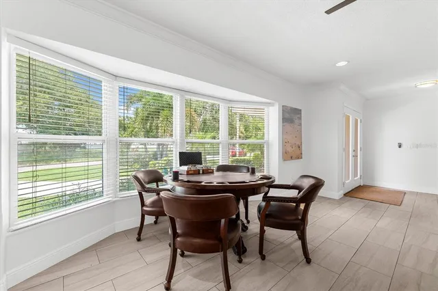 a view of a dining room with furniture and a table and chairs