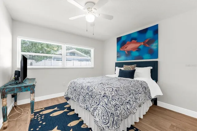 a bedroom with bed and window