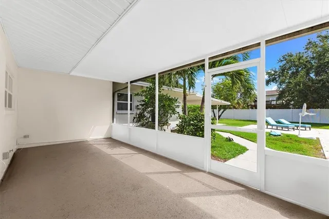 a view of a backyard with swimming pool