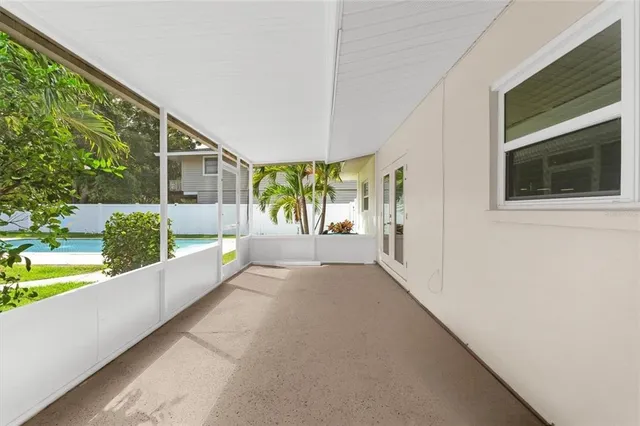 a view of a swimming pool with a yard