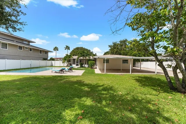 a view of a lake with a house in the background