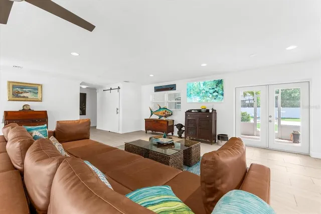 a bedroom with furniture and a wooden floor