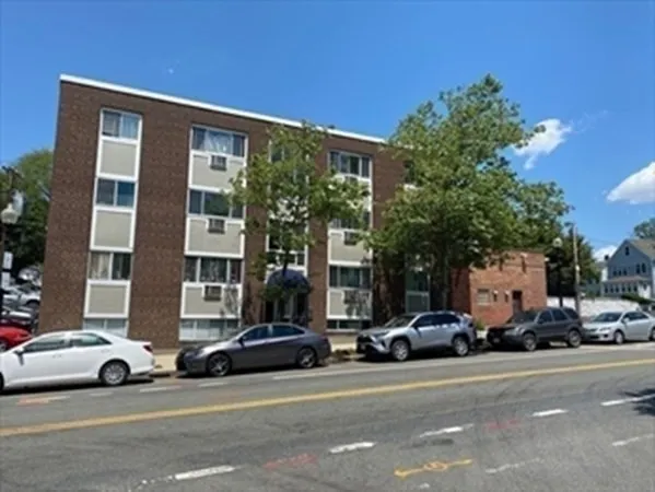 a view of a cars parked in front of a building