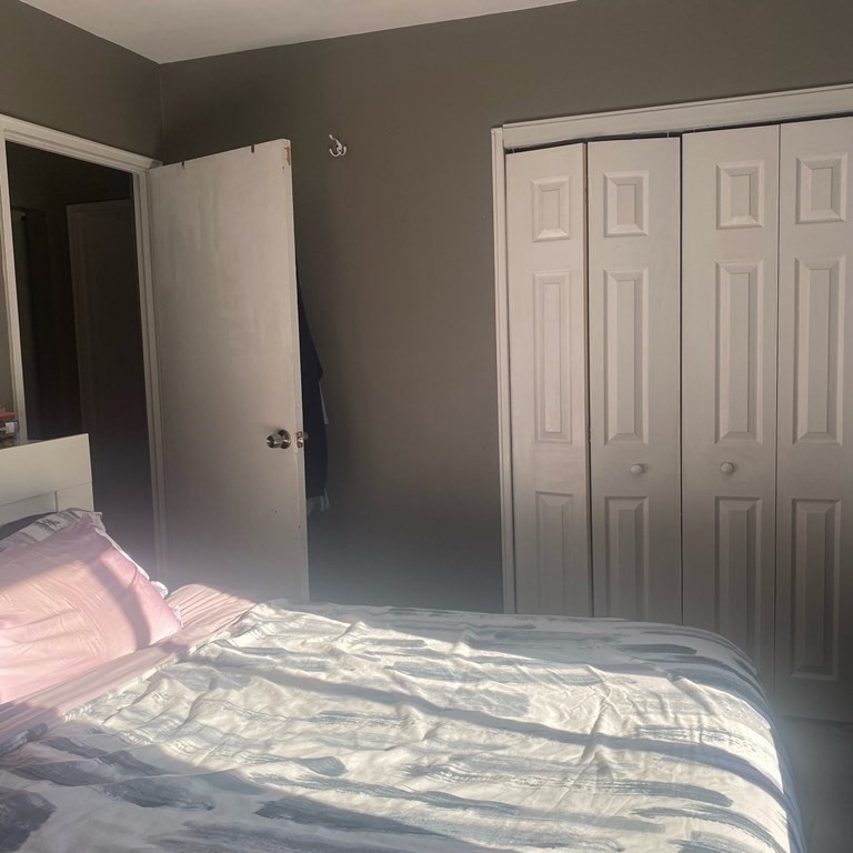 461 Washington Street, Unit 301 Boston, MA 02135 - Photo 8 of 14 a view of a livingroom with wooden floor