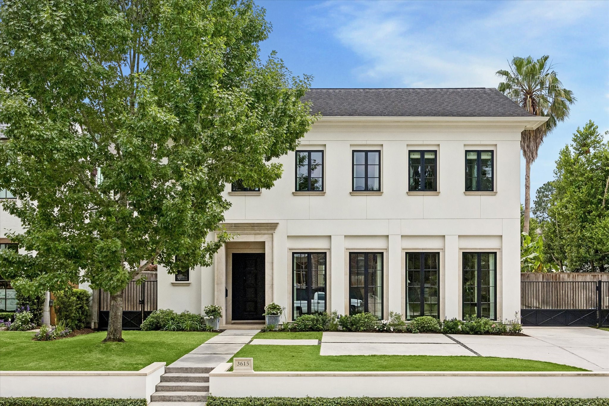 3615 Overbrook Lane Houston, TX 77027 - Photo 1 of 34 a front view of a house with a yard