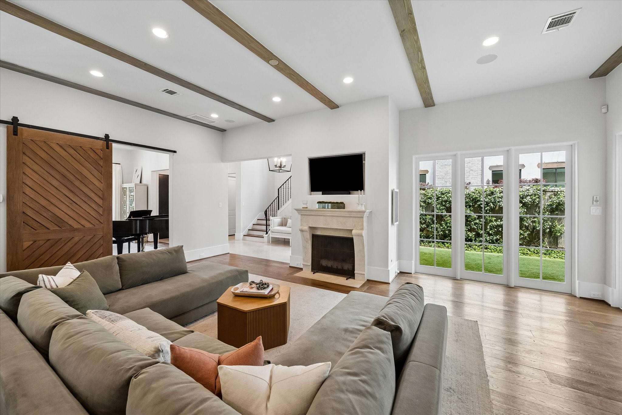 3615 Overbrook Lane Houston, TX 77027 - Photo 12 of 34 a living room with furniture a fireplace and a flat screen tv