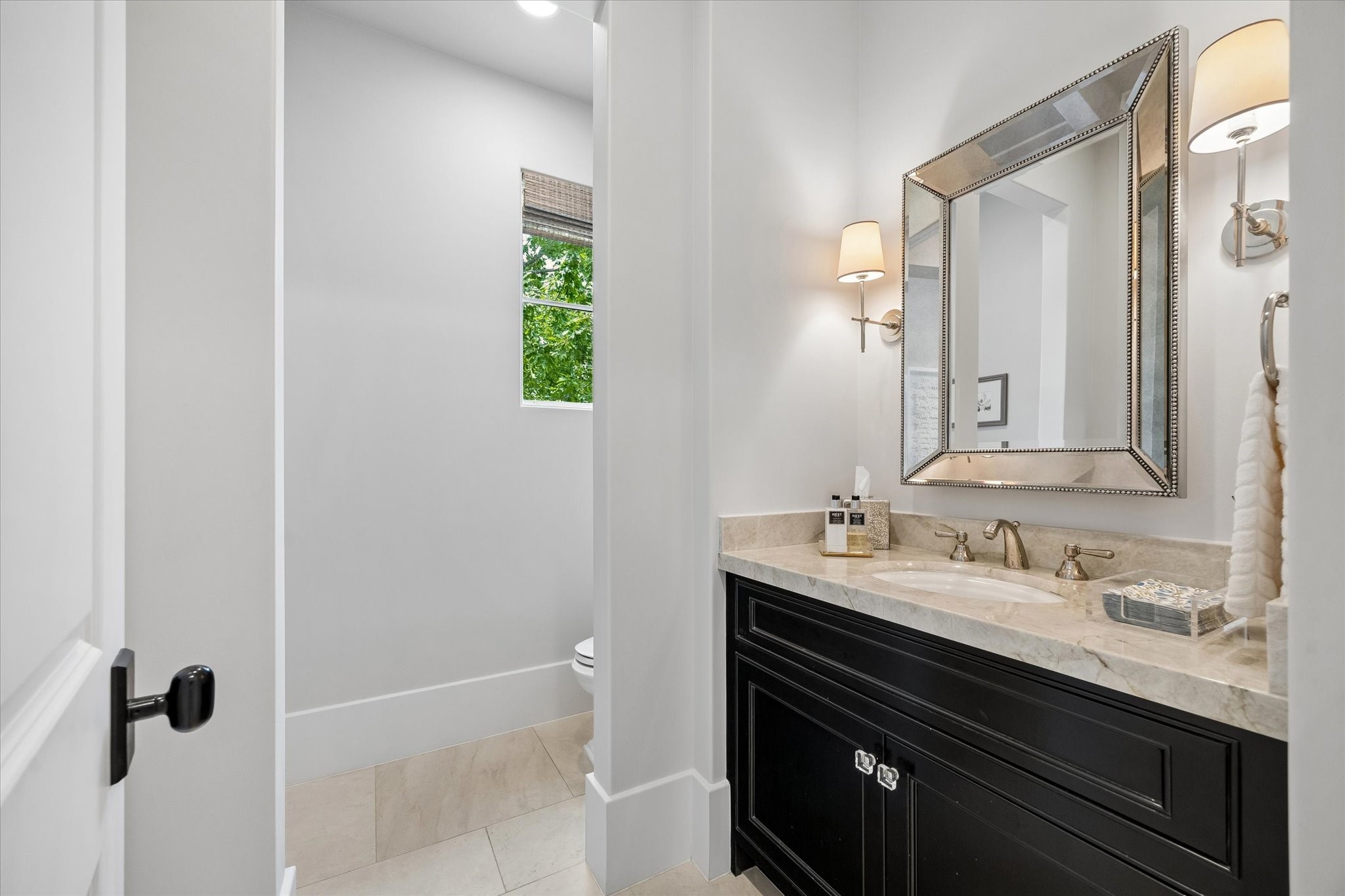 3615 Overbrook Lane Houston, TX 77027 - Photo 19 of 34 a bathroom with a sink and a mirror