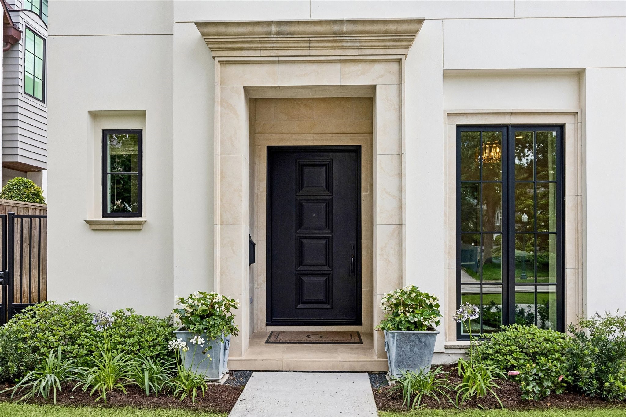3615 Overbrook Lane Houston, TX 77027 - Photo 2 of 34 front view of a house with a potted plant