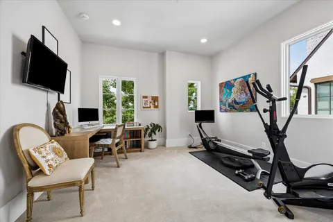 a view of a livingroom with furniture and a flat screen tv