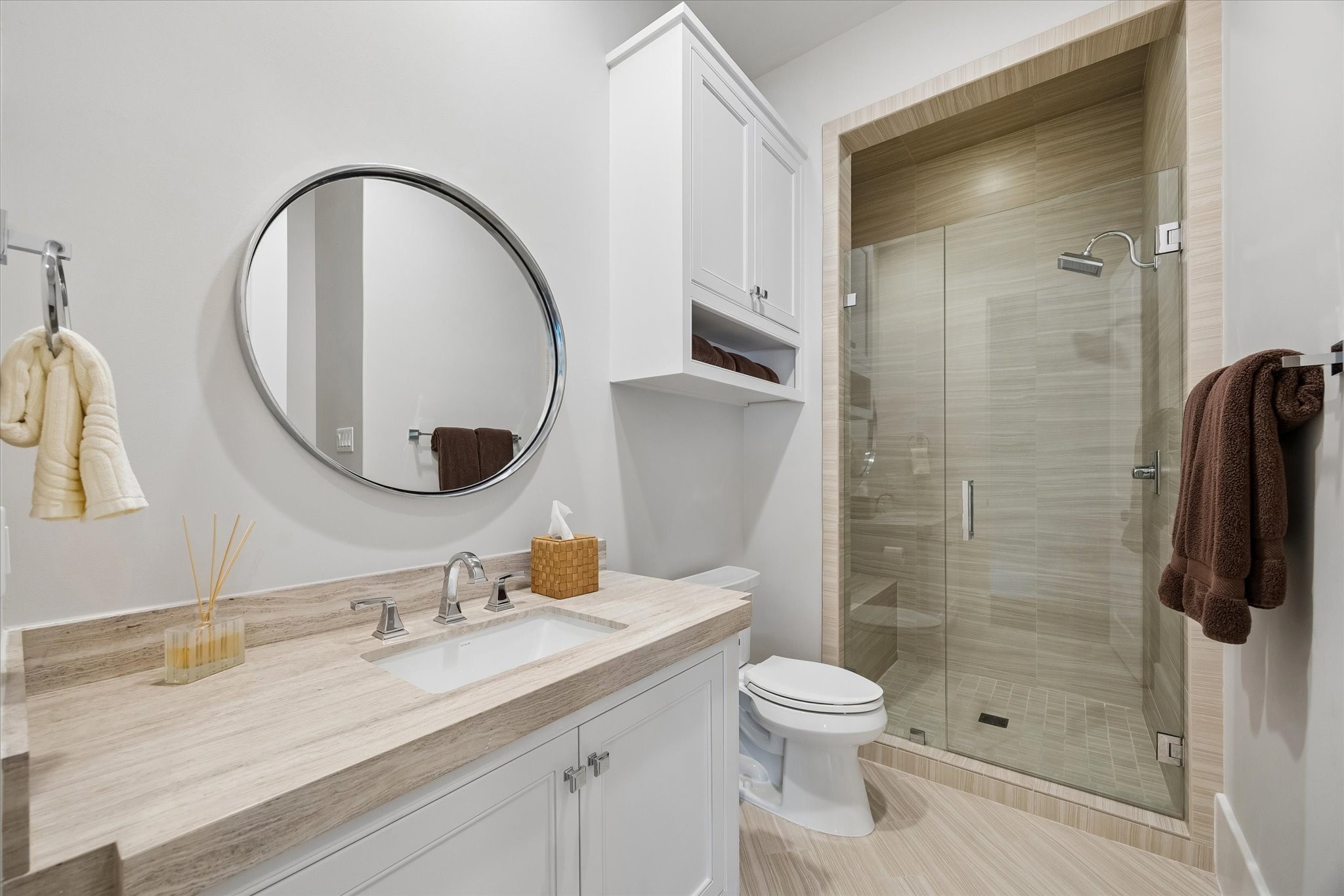 3615 Overbrook Lane Houston, TX 77027 - Photo 28 of 34 a bathroom with a granite countertop sink toilet and shower