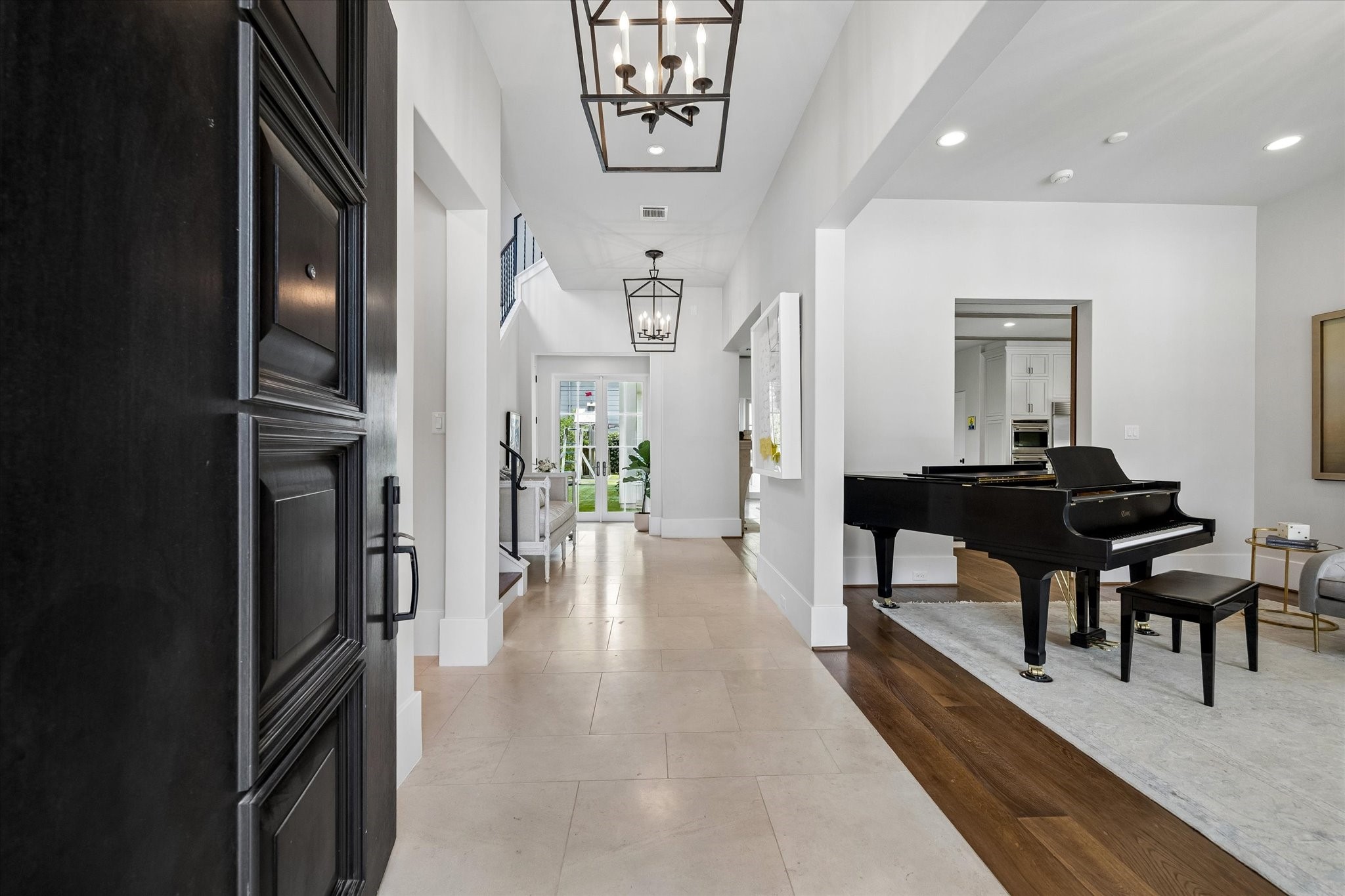 3615 Overbrook Lane Houston, TX 77027 - Photo 3 of 34 a dining room with furniture and a chandelier